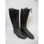 Pair of black leather riding boots with spurs