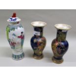 Pair of W. and R. Carlton Ware chinoiserie decorated baluster form vases on dark blue ground,
