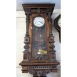 Late 19th Century walnut cased Vienna type wall clock, the enamel dial with Roman numerals and two