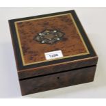 19th Century amboyna ebonised and line inlaid work box, the hinged cover enclosing sewing related