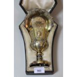 19th Century Continental silver gilt communion cup and paten, in the original fitted case, 13oz