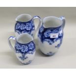 Graduated set of three Royal Doulton blue and white jugs