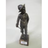 Otto Schmidt-Hofer, small dark patinated bronze figure of a Dutch boy holding a stick, signed in the