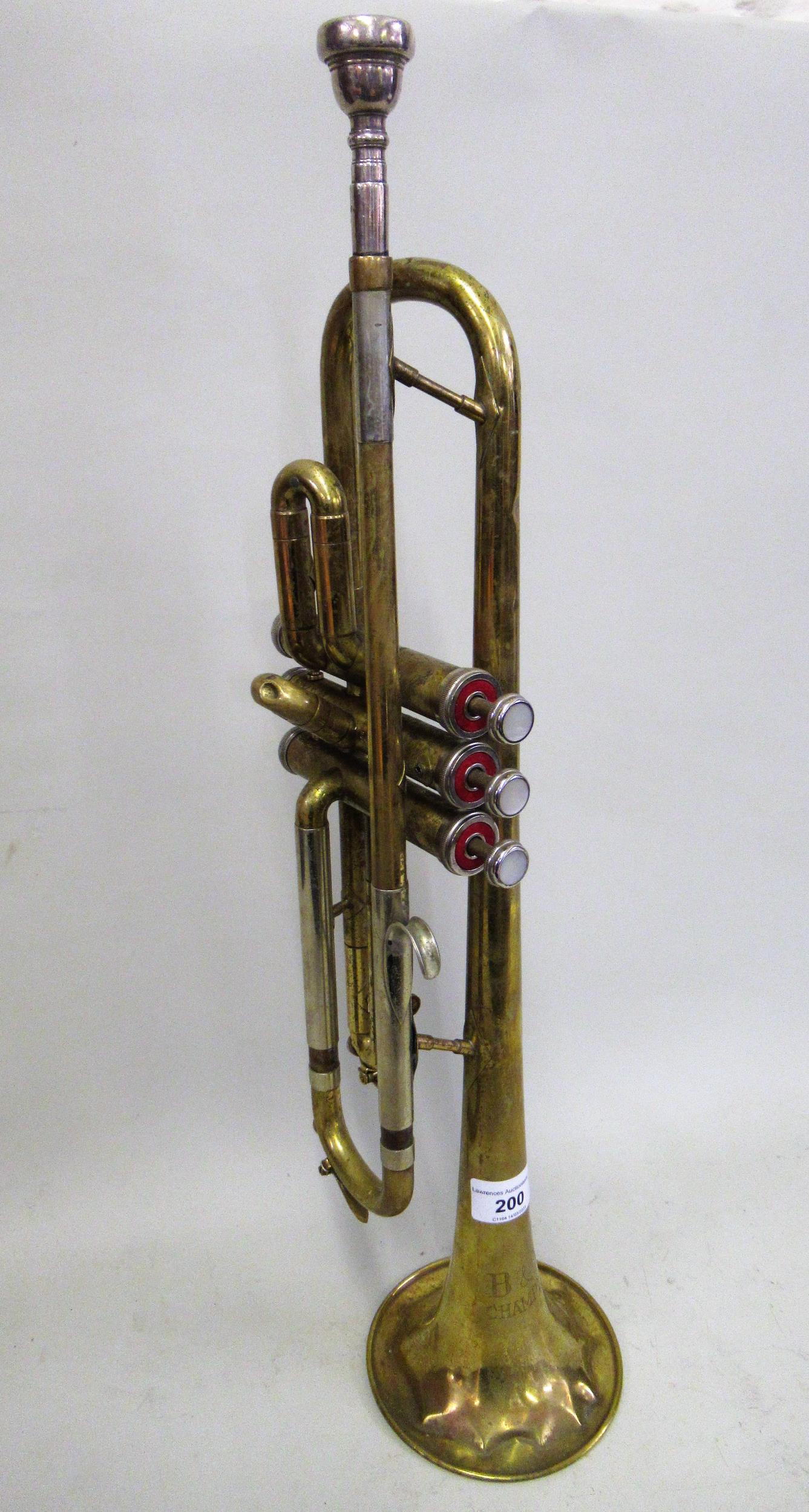20th Century brass trumpet with mouthpiece, engraved B&M Champion