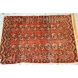Antique Tekke rug with three rows of eight gols on a wine ground with borders, 159cms x 113cms