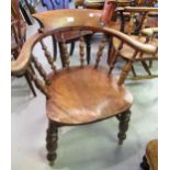19th Century elm and mahogany smokers bow chair with a baluster turned spindle back, panel seat