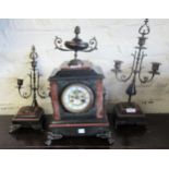 19th Century black slate and rouge marble three piece clock garniture, the clock with enamel dial,