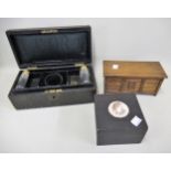 Leather jewellery box with part original contents, miniature oak coffer and a small ebonised box