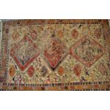 Soumak rug with three central medallions and various figures of birds, with multiple borders on a
