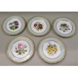 Set of five late 19th / early 20th Century hand painted floral decorated plates with gilded rims,