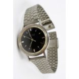 Gentleman's Bulova Accutron steel cased wristwatch with black dial and replacement strap At