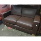 Small dark tan simulated leather two seat sofa or rectangular design, 135cms wide