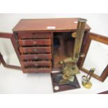 J.H. Steward, London, gilt brass and black metal monocular microscope with accessories, in a