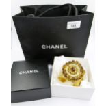 Chanel, gilt metal bangle (at fault), with Chanel box and bag One pearl missing from the top (see