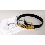 Moschino, Milano, black leather belt with gold tone metal lettering, size 38, having original dust