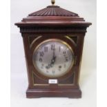 Early 20th Century mahogany and brass mounted bracket clock, the circular silvered dial with