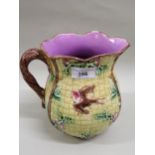 19th Century French Majolica jug decorated with birds and foliage Various chips to rim, crazing