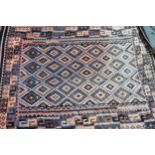 Large antique Kelim rug in shades of rose, pink and blue, with an all-over geometric design,