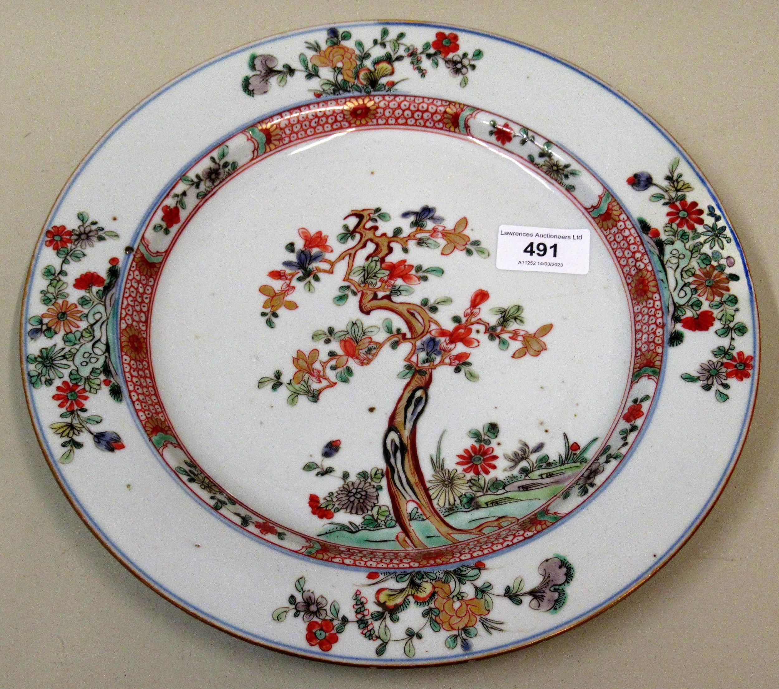 18th Century Chinese circular wall plate painted with a flowering tree, 28cms diameter (at fault)