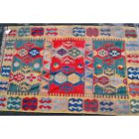 Turkish Kelim rug in shades of beige, red, blue and teal, 260cms x 170cms
