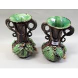 Pair of Portuguese Palissy style vases with serpent handles, decorated with lizards etc. 25cms