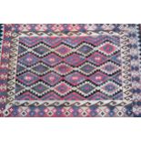 Small Kelim rug in shades or rose, pink, beige and brown, with an all-over geometric design, 24cms x