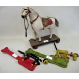 Child's early 20th Century pull-a-long toy horse, together with two Fisher-Price Toys wooden