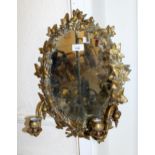 Late 19th / early 20th Century brass two branch girandole, the frame in the form of ivy leaves
