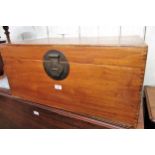 Eastern camphor wood rectangular trunk, the hinged cover above brass lock plate and loop end