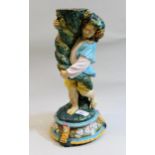 19th Century Continental majolica stand in the form of a child holding a cornucopia (lacking top)