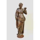 17th / 18th Century Continental carved oak figure of a standing classical female holding a cup,