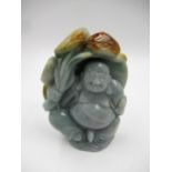 20th Century two colour celadon jade figure of a standing Buddha, 11cm high approximately