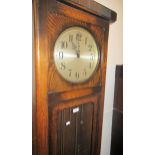 Early to mid 20th Century oak longcase clock with a three train weight driven striking movement,