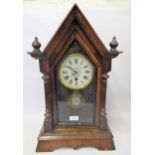 19th Century American mantel clock of Gothic design with a painted dial, Roman numerals and single