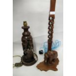 African figural carved hardwood lamp base, together with another lamp base mounted with a figure