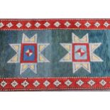 Turkish runner of Kazak design, with green blue ground and red border, 4metres x 86cms