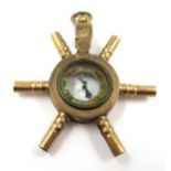 10ct Yellow gold novelty pocketwatch key in the form of a ships wheel with central compass,