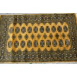 Pakistan rug of Turkoman design with two rows of gols on a beige ground, 153cms x 90cms Overall in