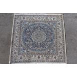 Square Nain type rug with a circular medallion in shades of blue and cream, 190cms square