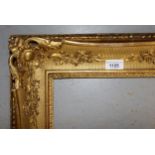 Early 19th Century, giltwood and composition picture frame, with scroll and leaf decoration (