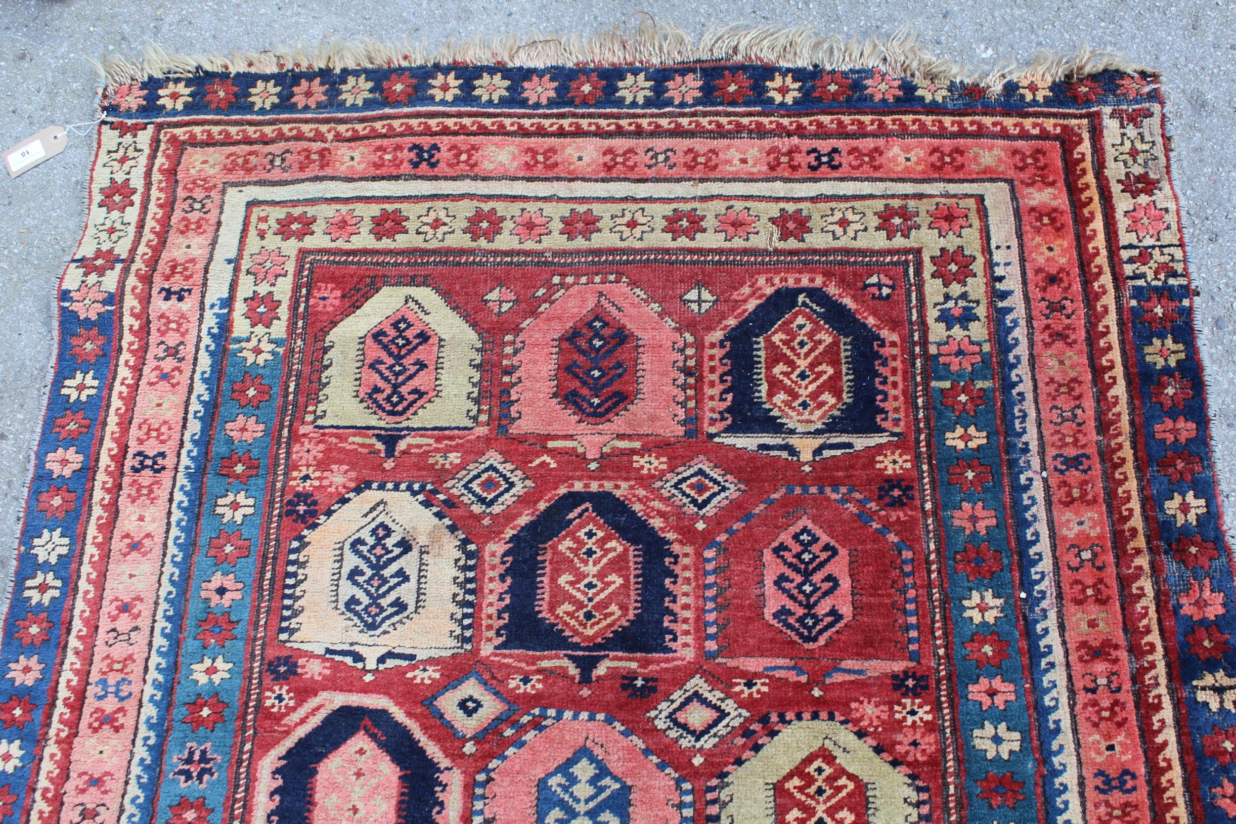 Kazak runner with an all-over stylised design on a brick red ground with borders, 250cms x 108cms - Image 4 of 5