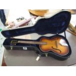 Late 1950's arch top acoustic guitar by Hofner with later case (damage to neck heel) Please see