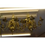 Pair of reproduction Dutch style brass, eight branch chandeliers
