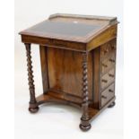 Victorian rosewood Davenport, the galleried top with a hinged sloping writing surface enclosing a