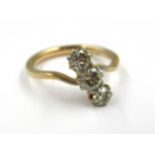Yellow gold three stone diamond set crossover ring (marks rubbed), size J