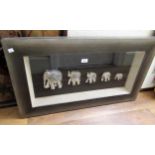 Framed modern Far Eastern group of five metal sculptures of elephants, 50cms x 90cms