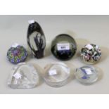 Seven various glass paperweights to include Caithness and Strathearn