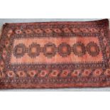 Afghan rug with a single row of six gols, 190cms x 115cms, together with a Pakistan rug of