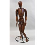 Artist's modern carved hardwood ley figure by Halfpenny Mannequins, mounted on a black painted metal