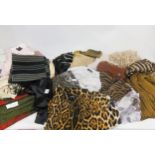 Large quantity of various scarves and pashminas including Yves Saint Laurent, Jimmy Choo, Esprit and